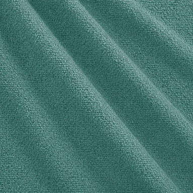 Castro Fabric in color Teal that has a wavy look is a Solid Bouclé Fabric that is good for Drapery & Curtain Fabric and Upholstery Fabric