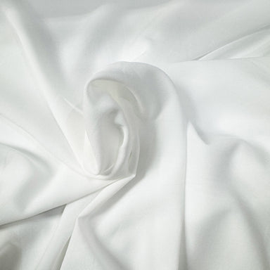 Coltan Fabric in color Ivory is a Solid Sheer Fabric that is good for Drapery & Curtain Fabric