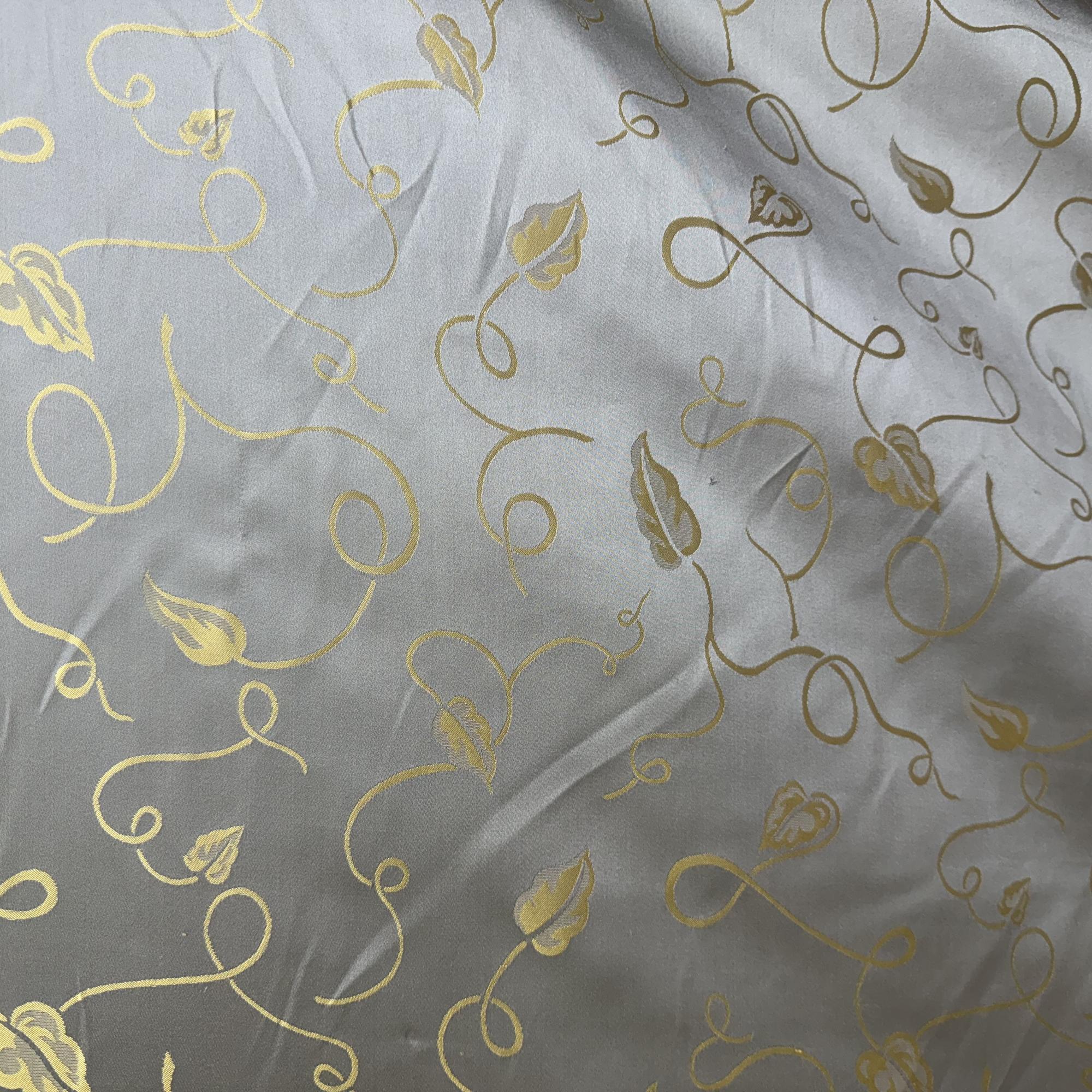 Jaipur Fabric in color Celadon is a Metallic Base Abstract Leaves Silk Fabric pattern good for Drapery & Curtain Fabric
