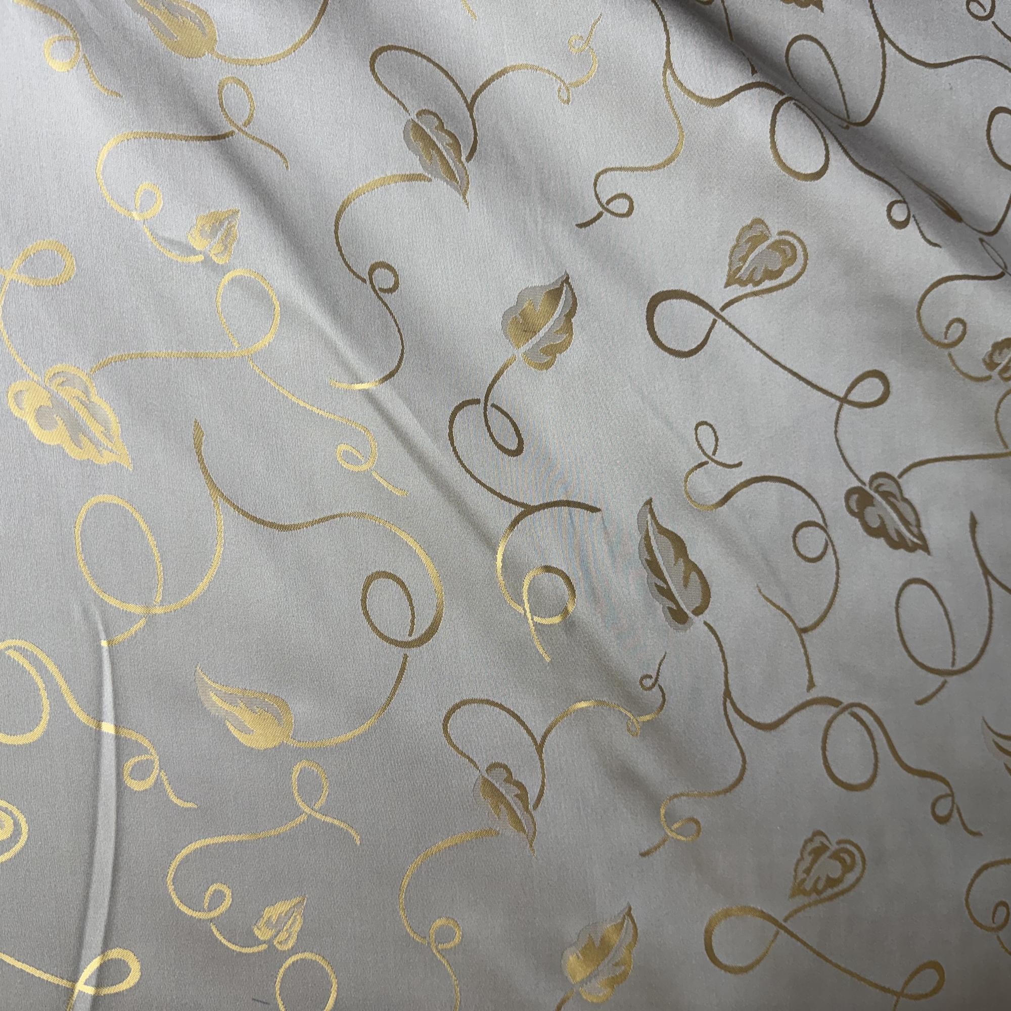 Jaipur Fabric in color Platinum  is a Metallic Base Abstract Leaves Silk Fabric pattern good for Drapery & Curtain Fabric