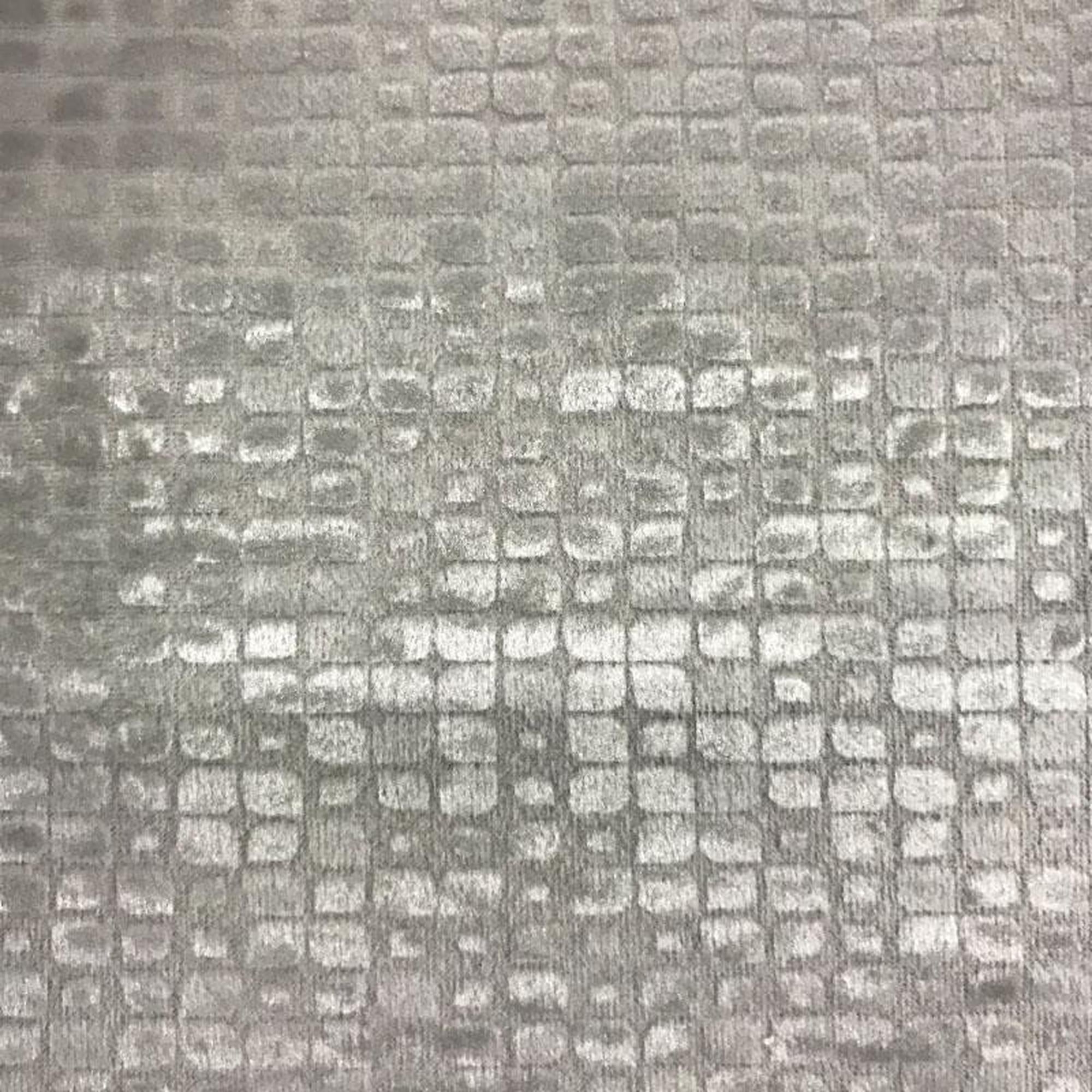 Baxter fabric in color Cream showcasing fabric embossed nrick-like velvet upholstery fabric.