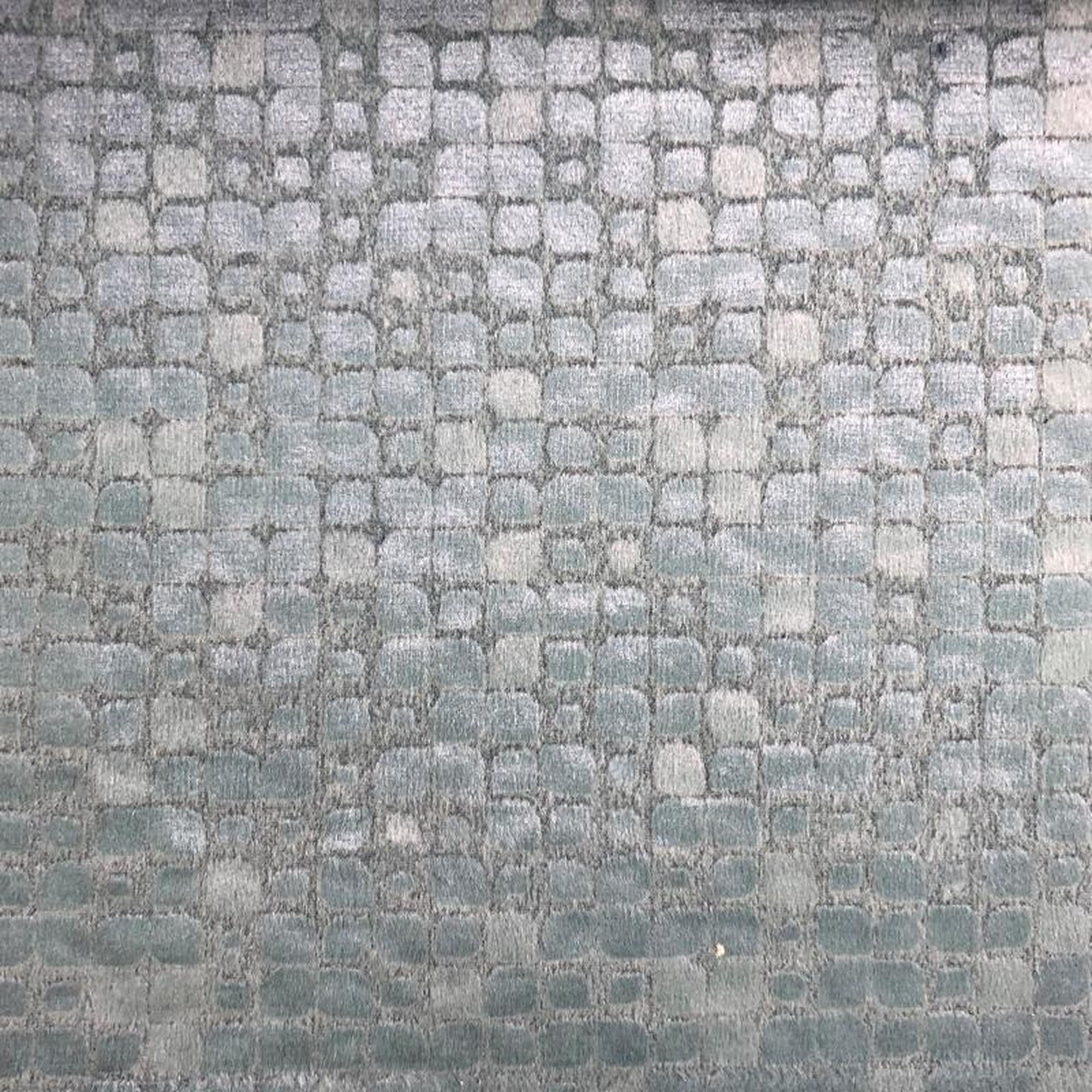 Baxter fabric in color Ocean showcasing fabric embossed nrick-like velvet upholstery fabric.