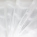 White lightweight sheer fabric with a refined texture, ideal for curtains and drapery. High-quality and stylish for any space.