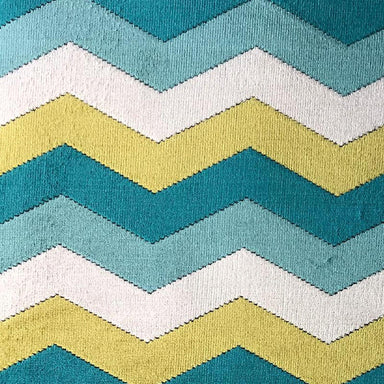 Fabiana fabric in color Turquoise showcasing fabric zig-zag chevron cut velvet upholstery fabric.