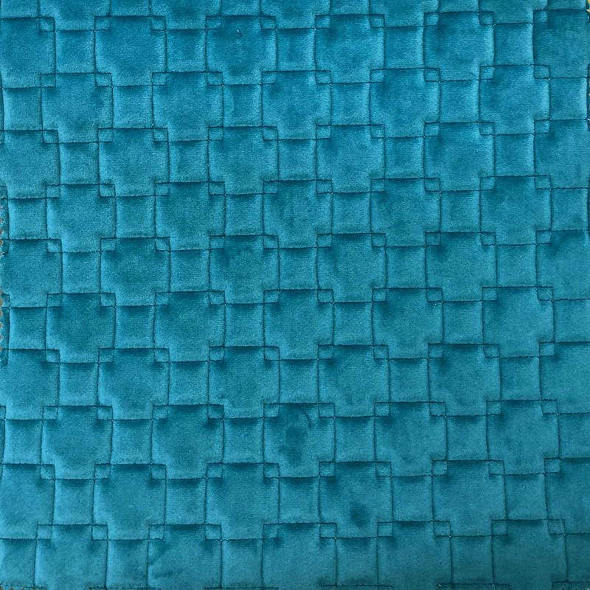 Kerry fabric in color Turquoise showcasing fabric quilt square velvet w/ backing upholstery fabric.