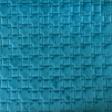 Kerry fabric in color Turquoise showcasing fabric quilt square velvet w/ backing upholstery fabric.