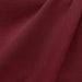 Linati fabric in color Cranberry showcasing fabric solid linen look upholstery fabric & drapery & curtain fabric & table linen fabric.